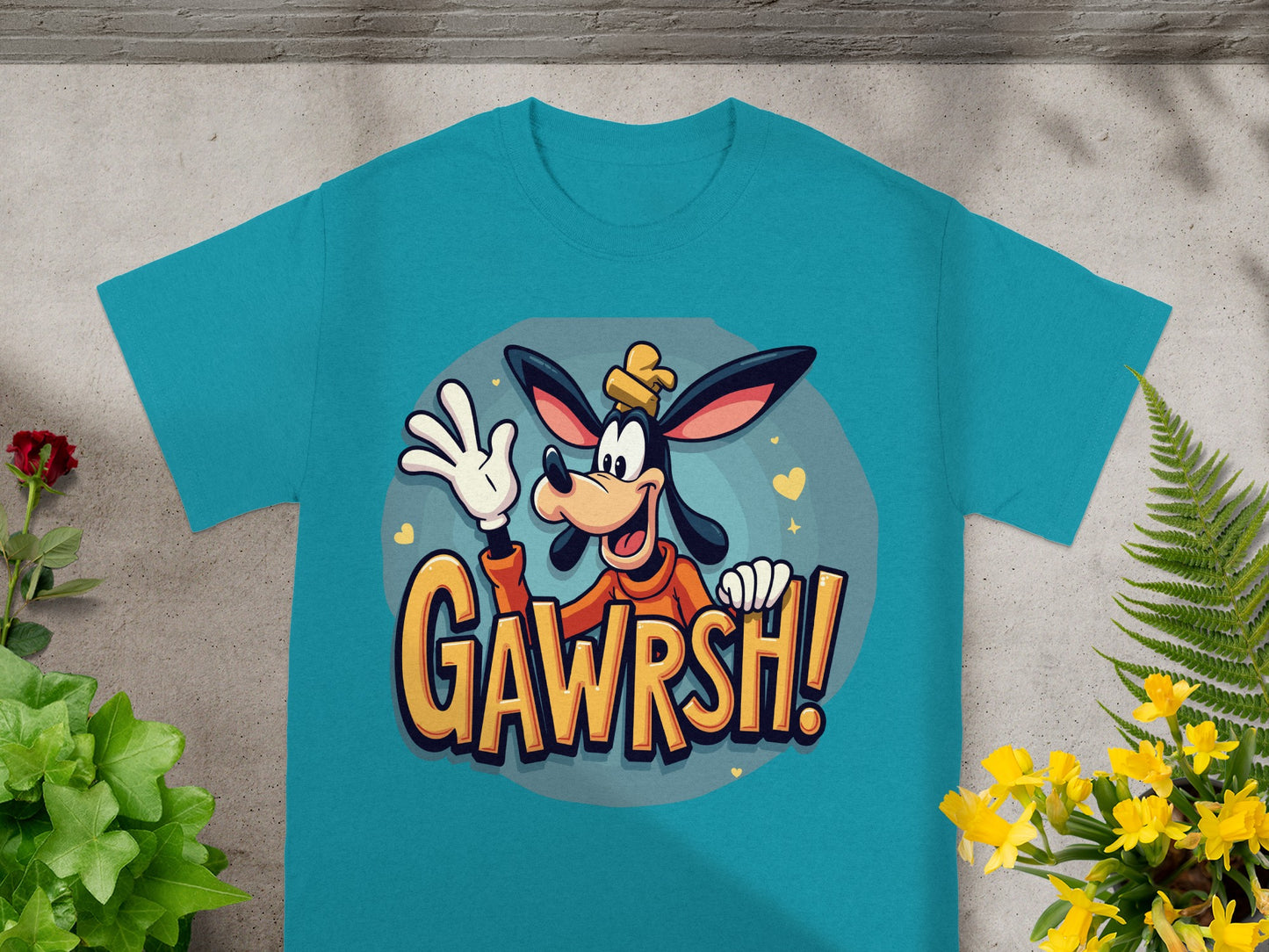 Teal t-shirt with cartoon Goofy wearing a hat, waving, and saying "GAWRSH!".