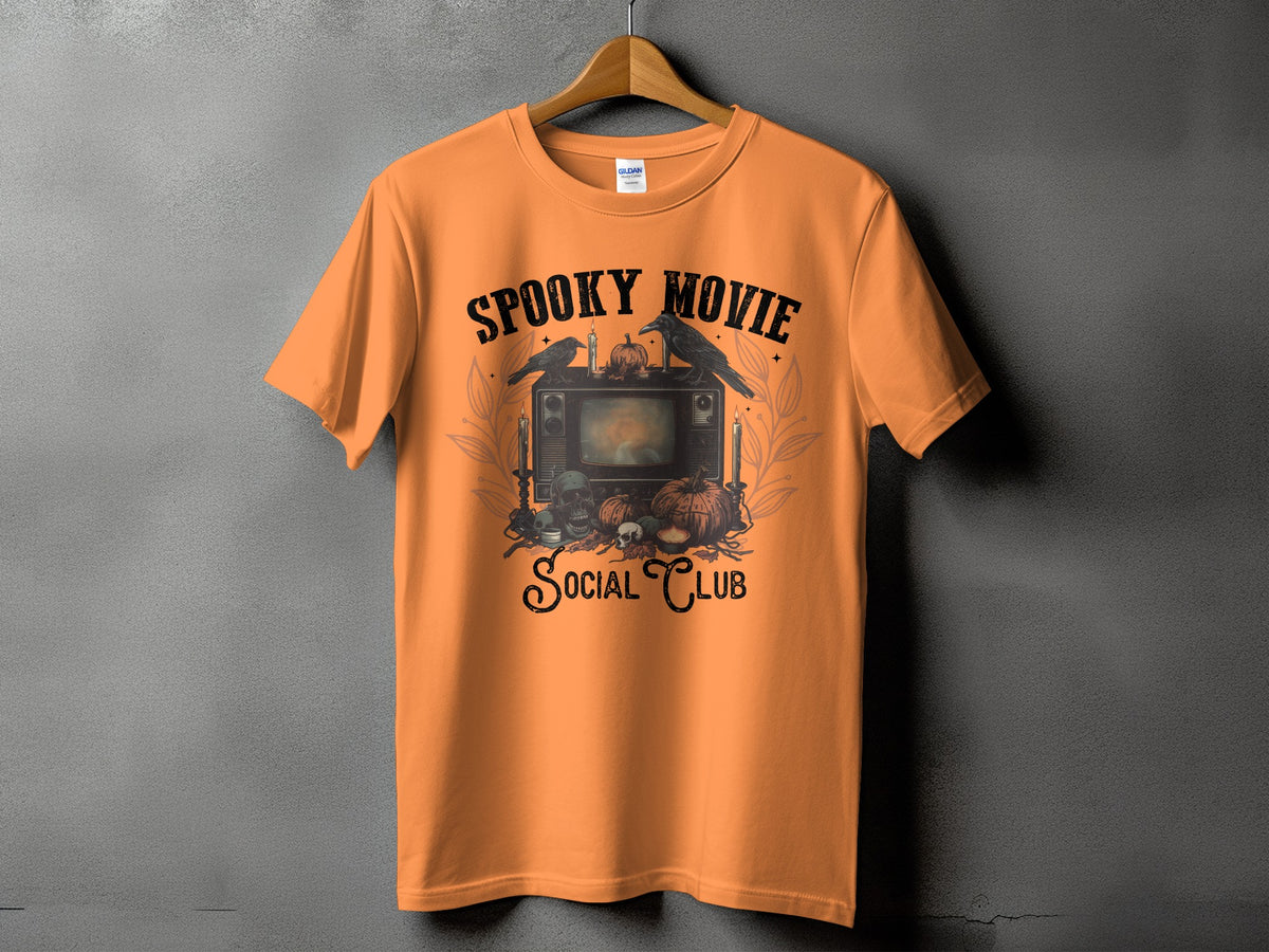 Orange t-shirt with spooky Halloween graphic and text "Spooky Movie Social Club".