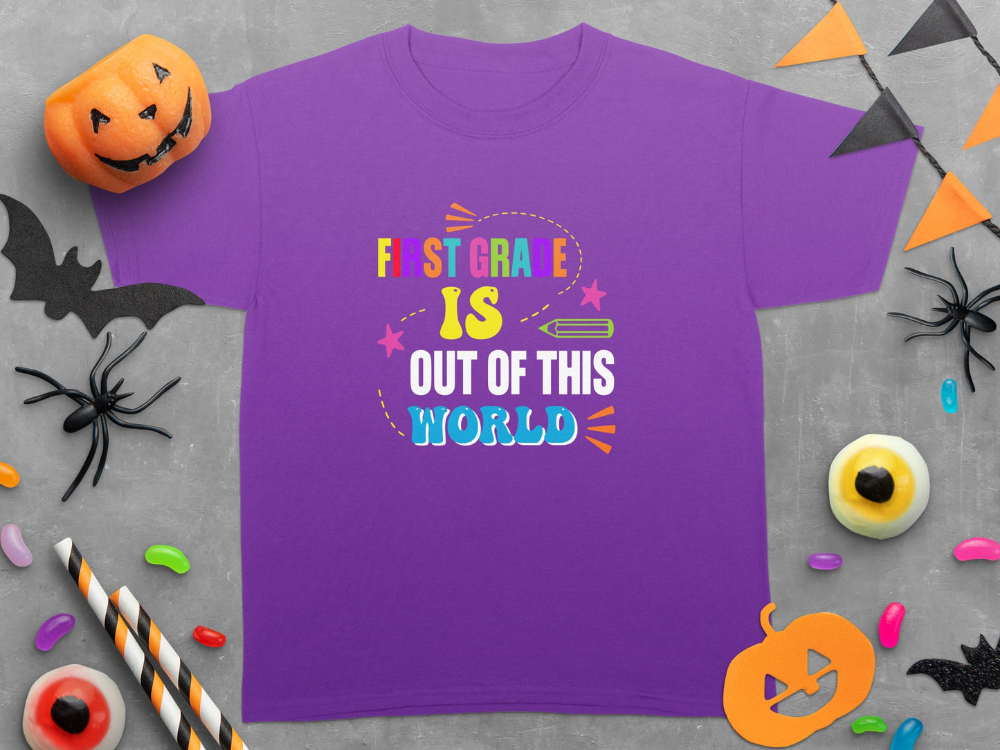 Purple t-shirt with "First Grade Is Out of This World" text in colorful lettering.