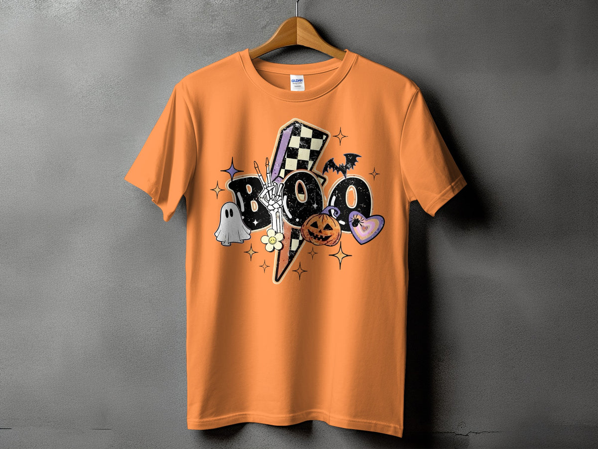 Orange t-shirt with Halloween graphic featuring the word "Boo", a skeleton hand, ghost, pumpkin, and bat.
