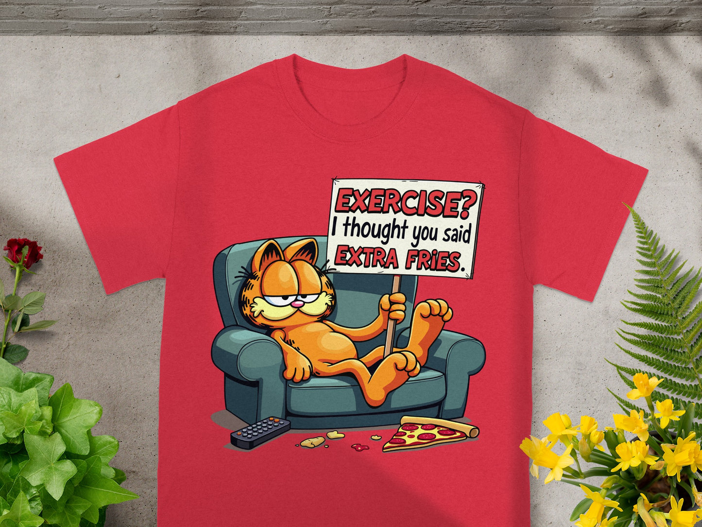 Red t-shirt featuring Garfield on a couch holding a sign that says "Exercise? I thought you said EXTRA FRIES."