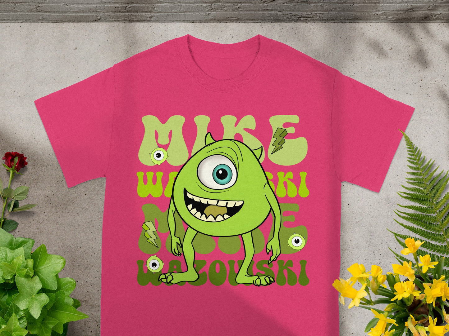 Mike Wazowski t-shirt with green monster and lightning bolts.