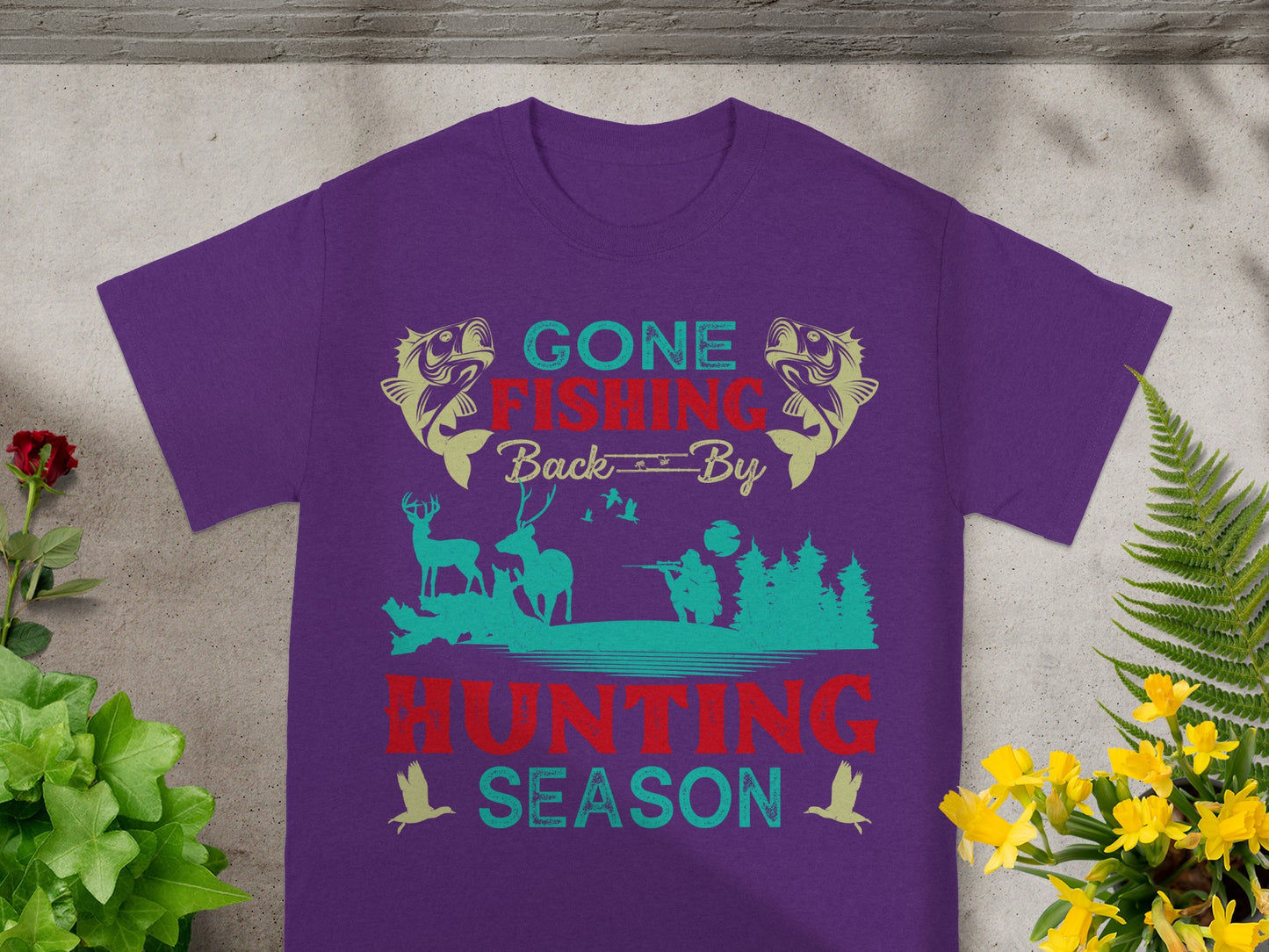 Purple t-shirt with "Gone Fishing Back By Hunting Season" text and graphics.