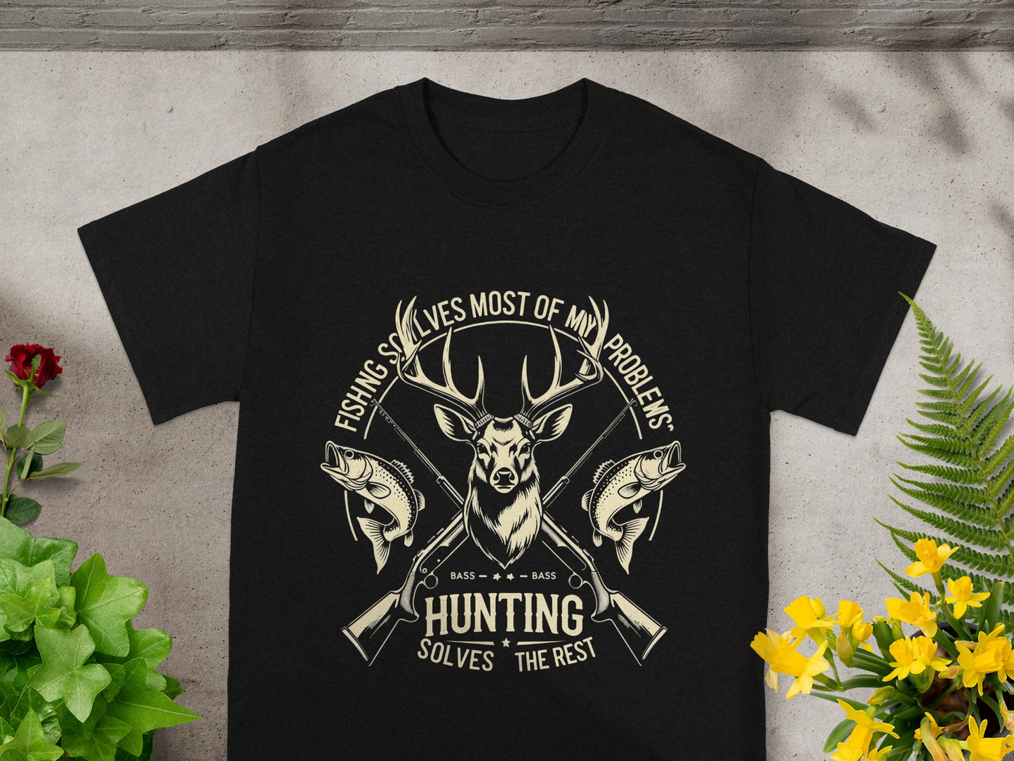 Black t-shirt with deer head, fish, rifles, and text: "Fishing solves most of my problems. Hunting solves the rest."