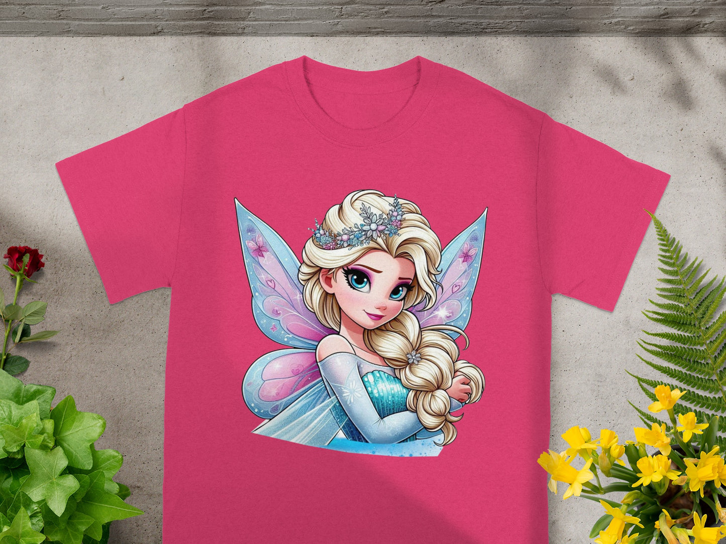 Pink t-shirt with Elsa from Frozen wearing a sparkly tiara and blue butterfly wings.