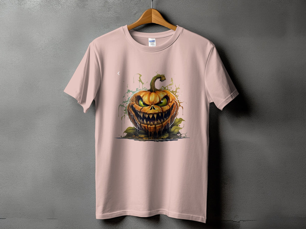 Pink t-shirt featuring a detailed illustration of a scary, grinning jack-o'-lantern with green eyes.