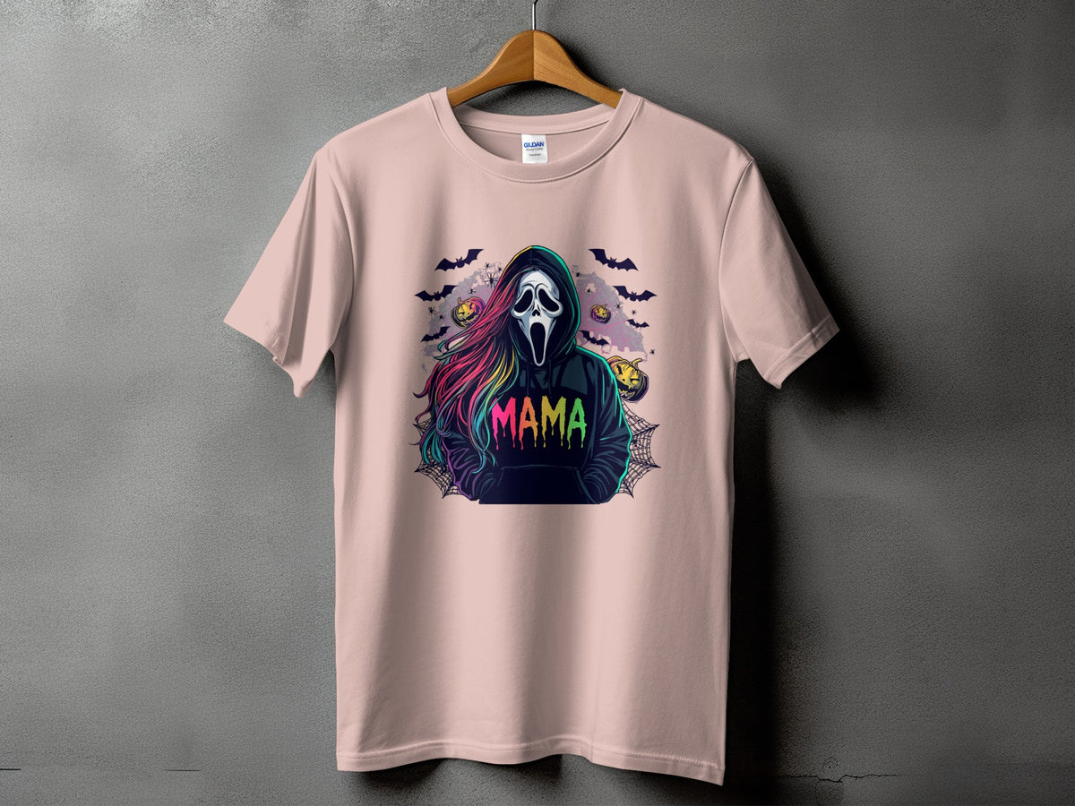 Pink t-shirt with a Halloween graphic featuring a ghost face and "Mama" text.