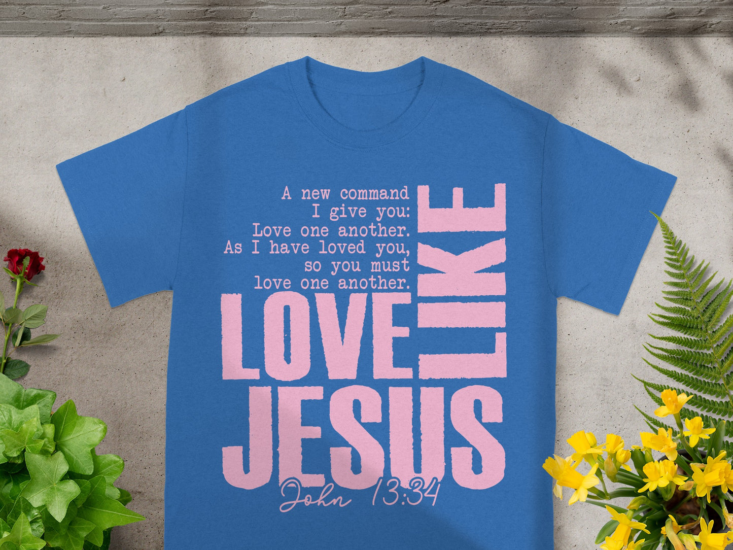 Blue t-shirt with pink text "LOVE JESUS" and Bible verse John 13:34.