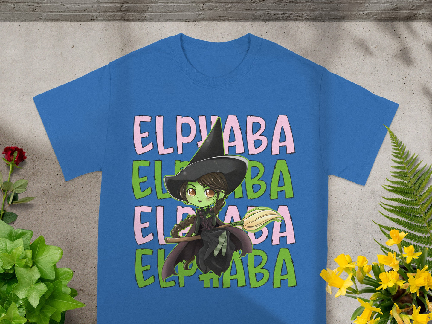 Blue t-shirt with green witch and "ELPVABA" text.