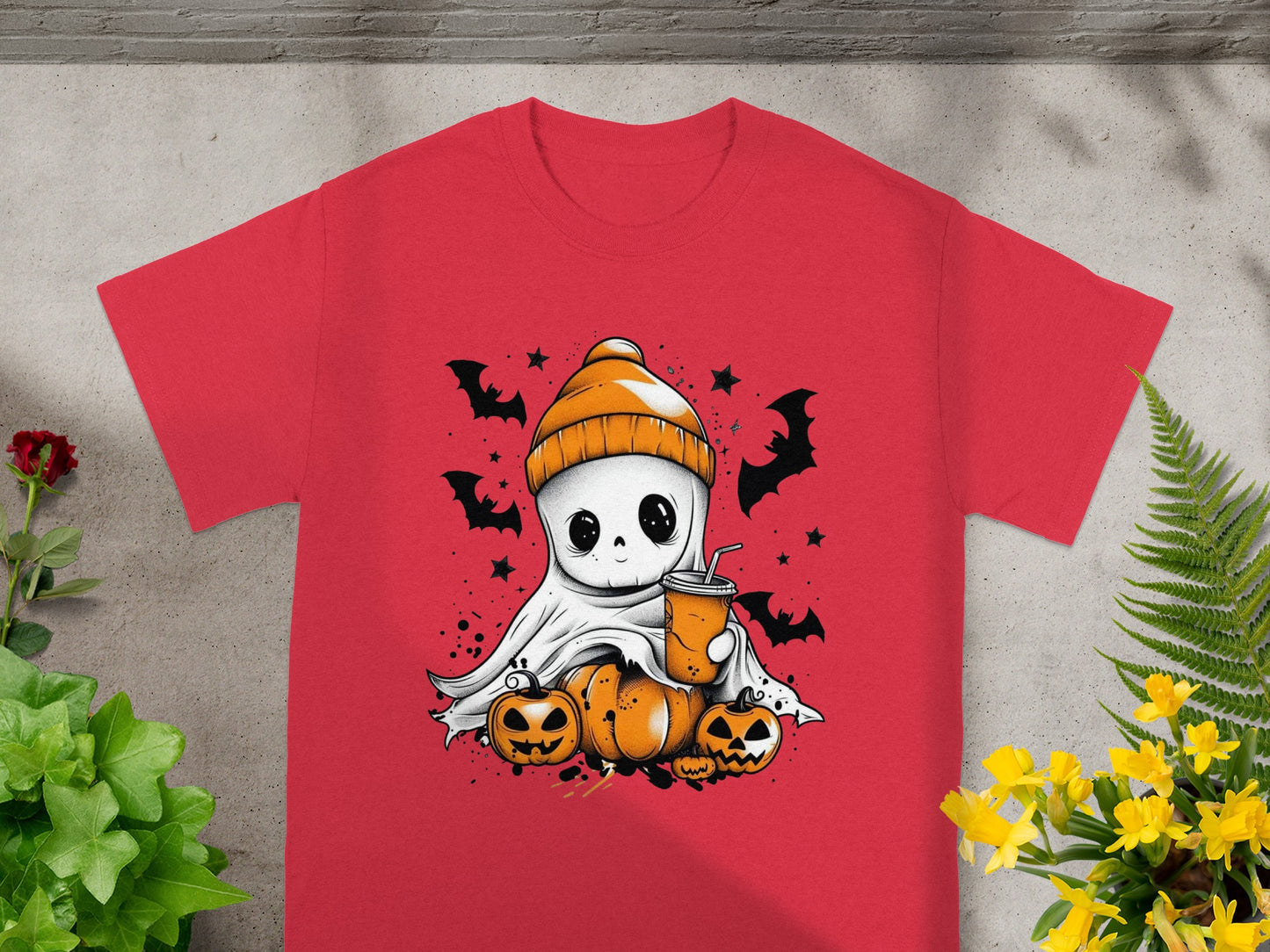 Cute ghost with pumpkins and bats, holding a drink on a red t-shirt.