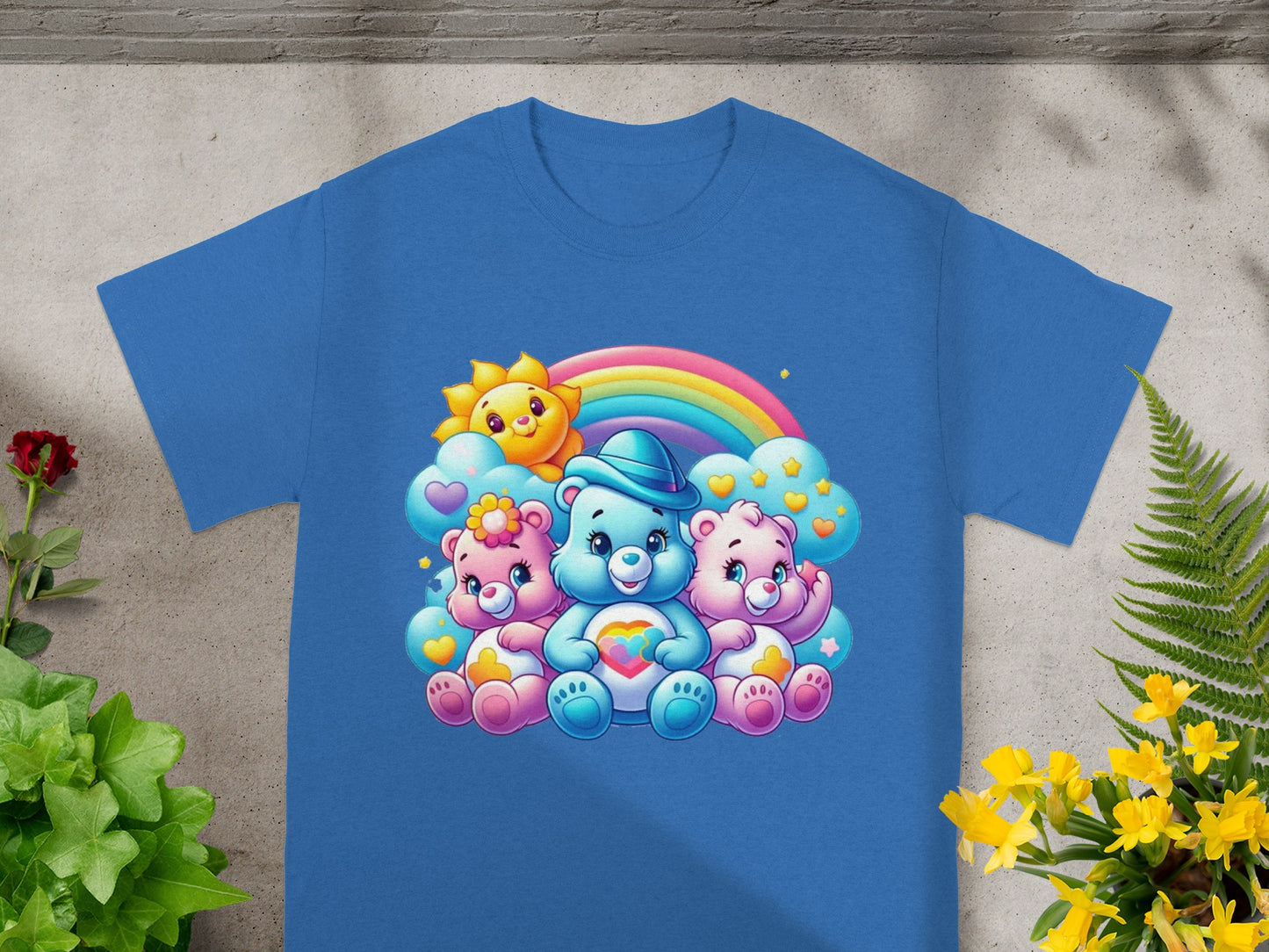 Three Care Bears sitting together under a rainbow and sun graphic.
