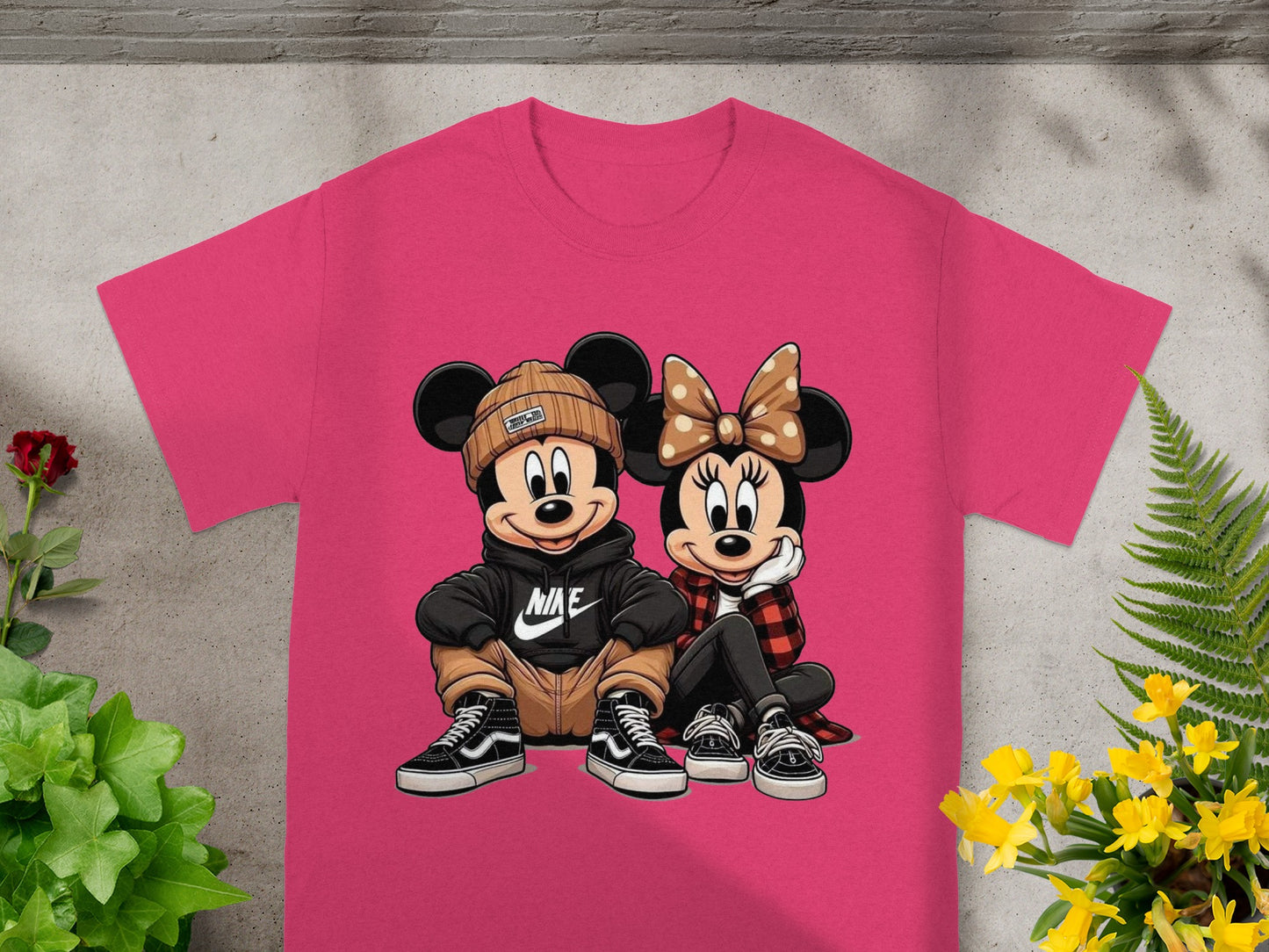 Mickey and Minnie Mouse graphic on a pink t-shirt.