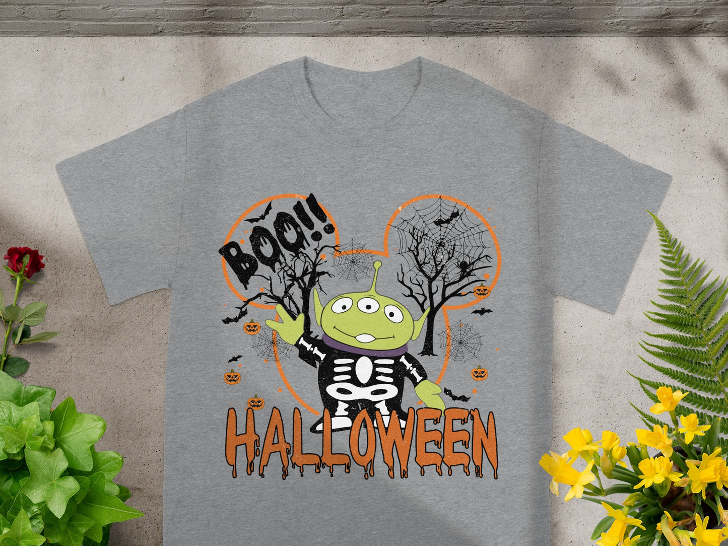 Grey t-shirt with a Toy Story alien skeleton graphic and Halloween text.