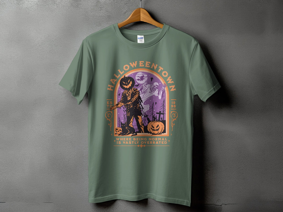 Green t-shirt with "Halloweentown" graphic featuring scarecrow, ghosts, pumpkin, and cat.