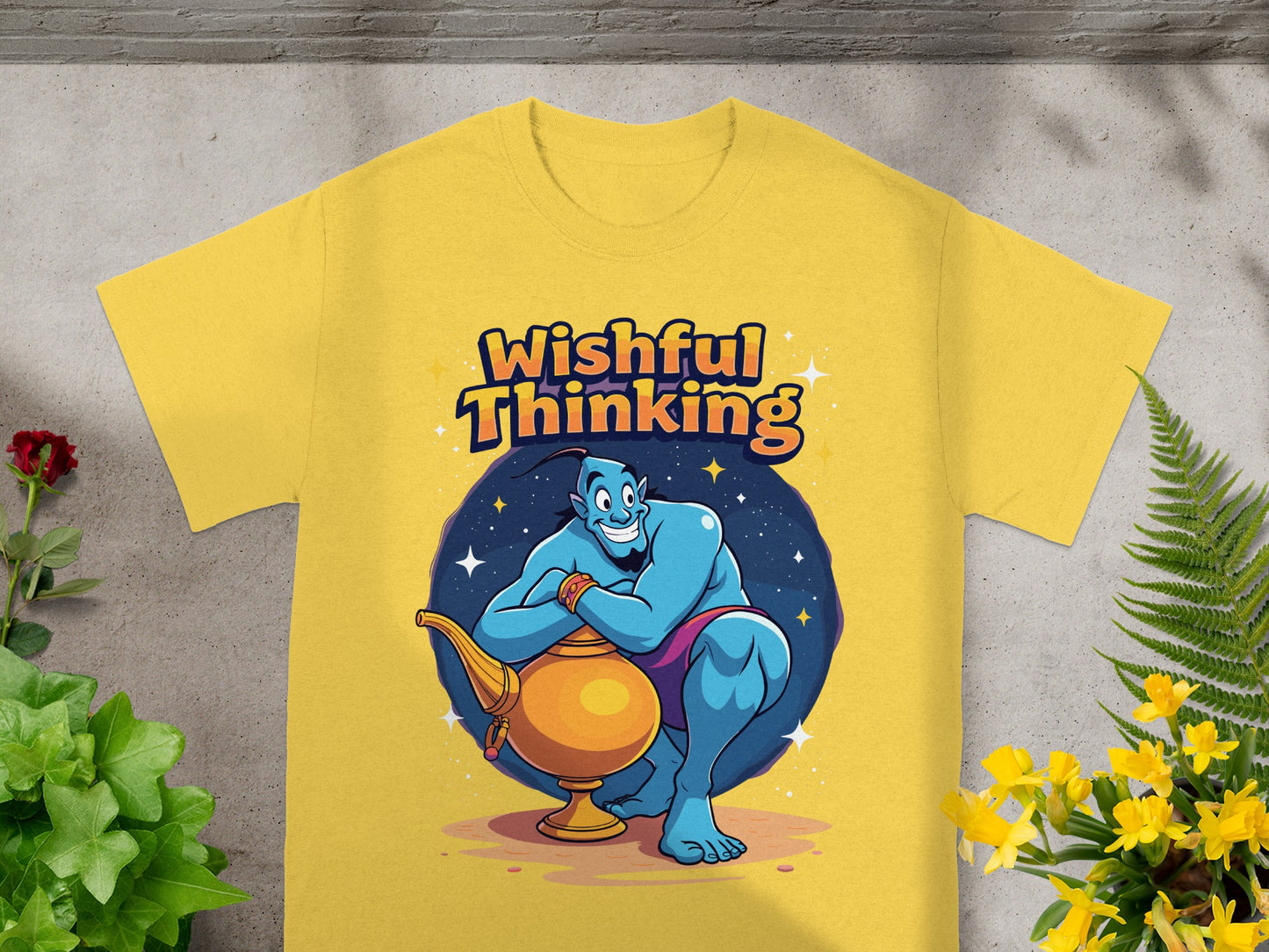 Genie with a lamp on a yellow t-shirt that reads "Wishful Thinking."