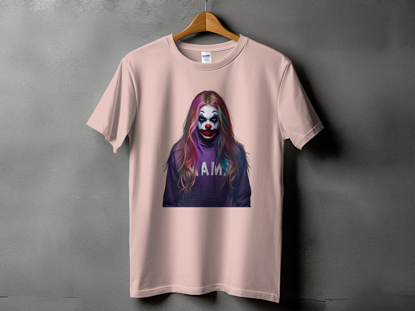 Pink t-shirt with a graphic of a clown with colorful hair and the word "MAMA".