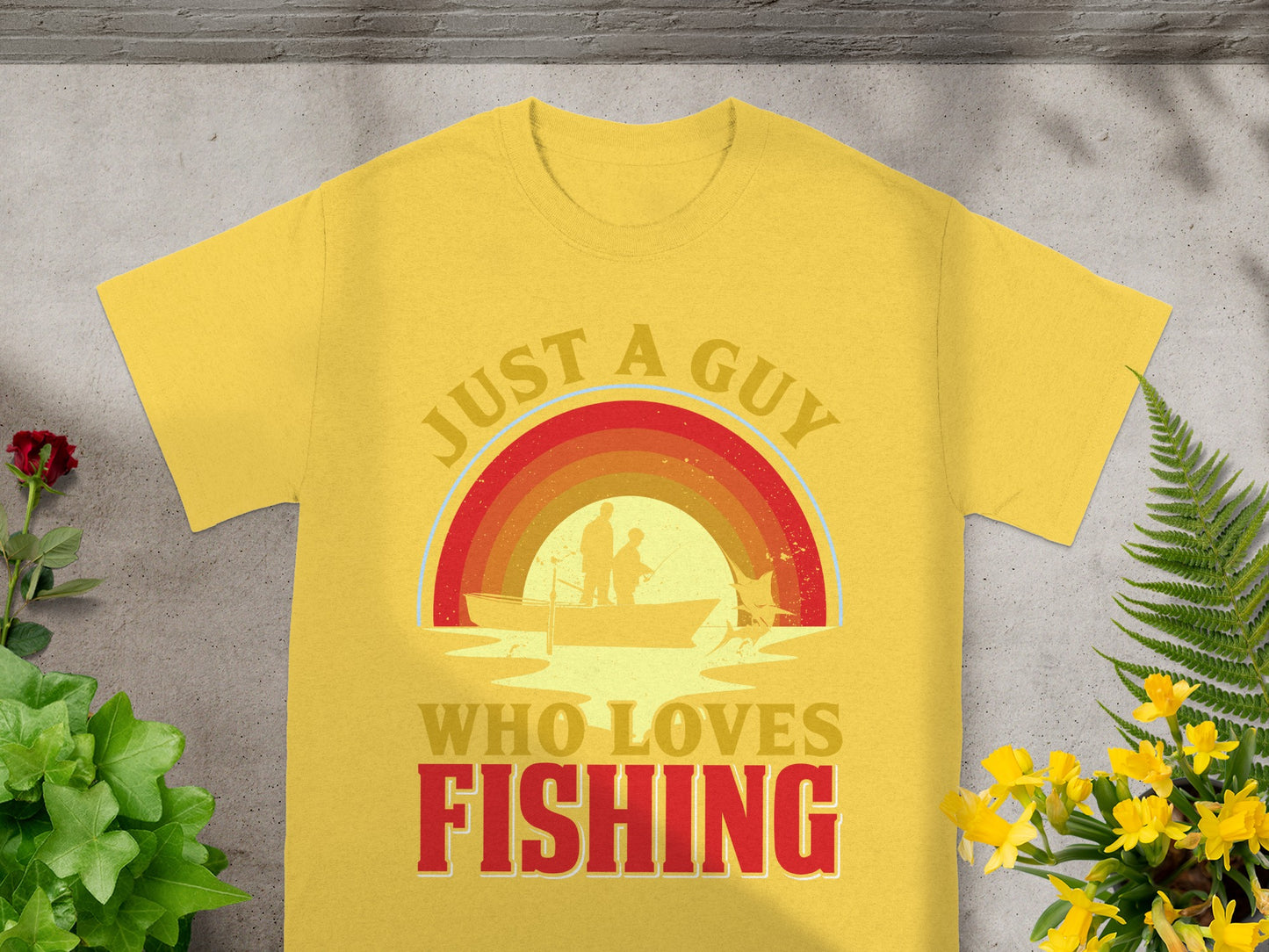 Yellow t-shirt with "Just a guy who loves fishing" text and fishing graphic.