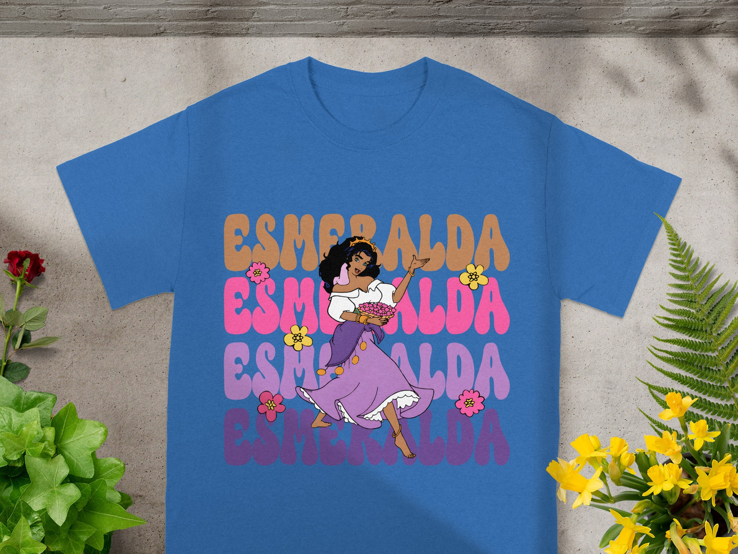 Blue t-shirt featuring Esmeralda dancing with flowers and text.