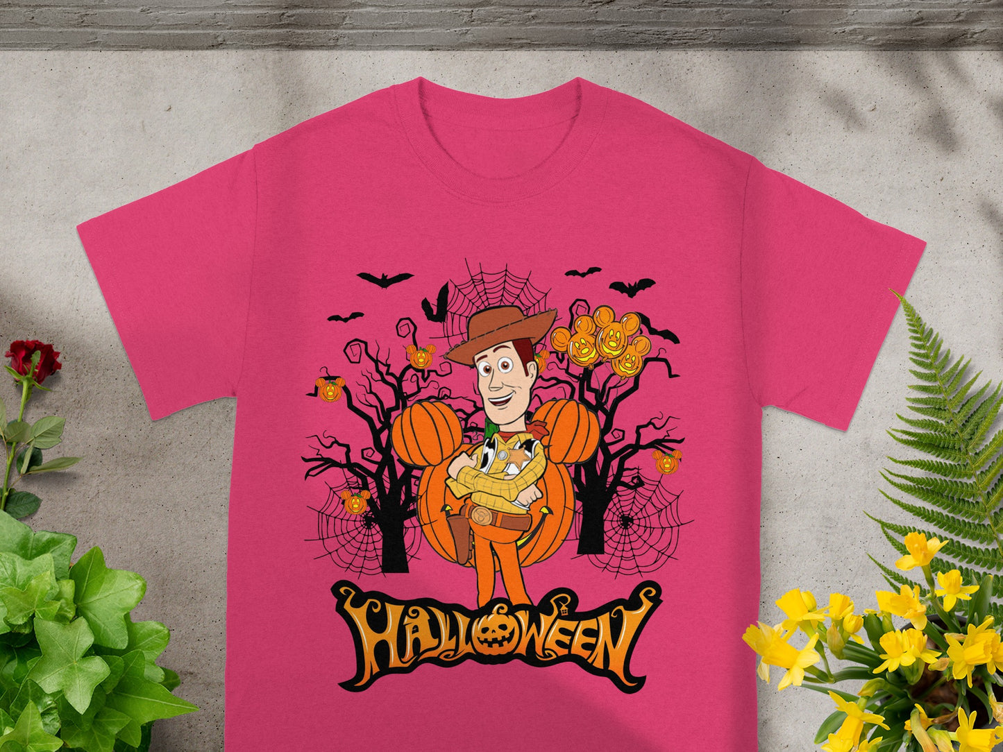 Pink t-shirt with Woody and Mickey pumpkins, Halloween text.