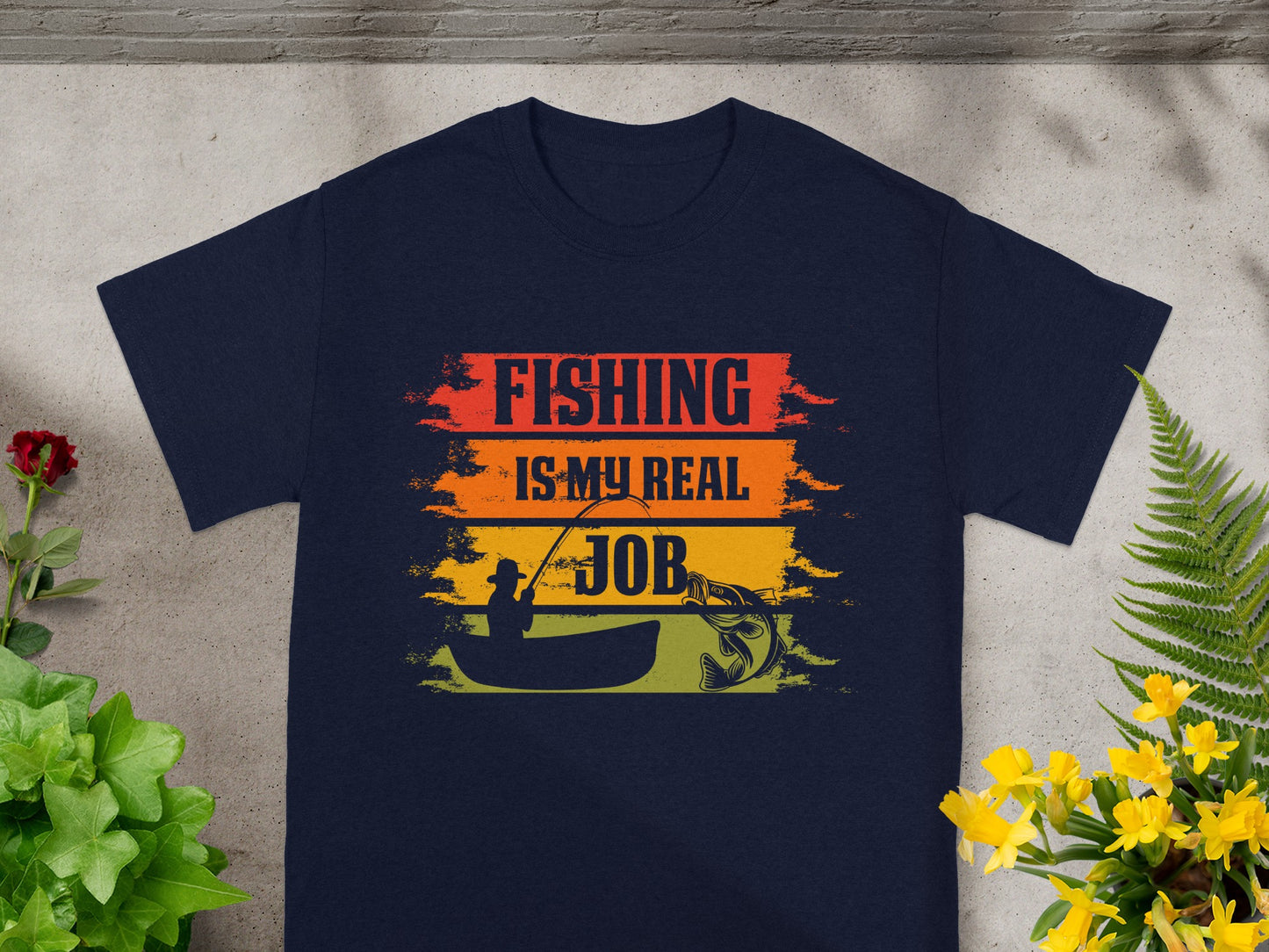 Navy t-shirt with "Fishing is my real job" text and fishing graphic.
