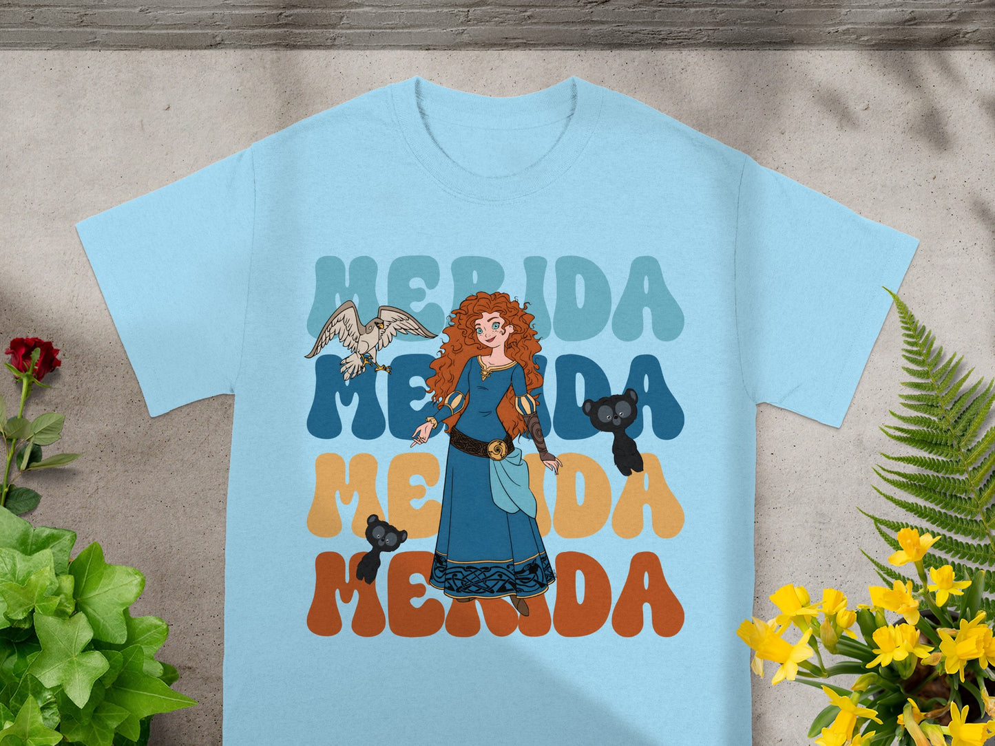 Light blue t-shirt featuring Merida from Brave with retro text.