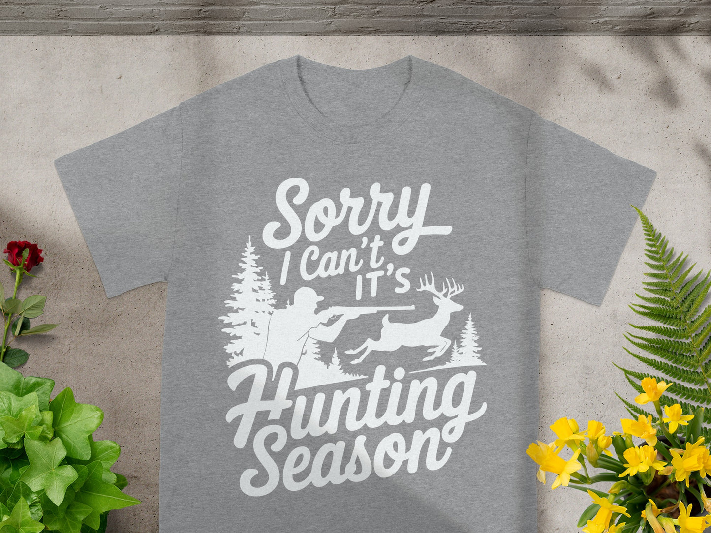 Grey t-shirt with "Sorry I Can't It's Hunting Season" text and a hunter and deer graphic.
