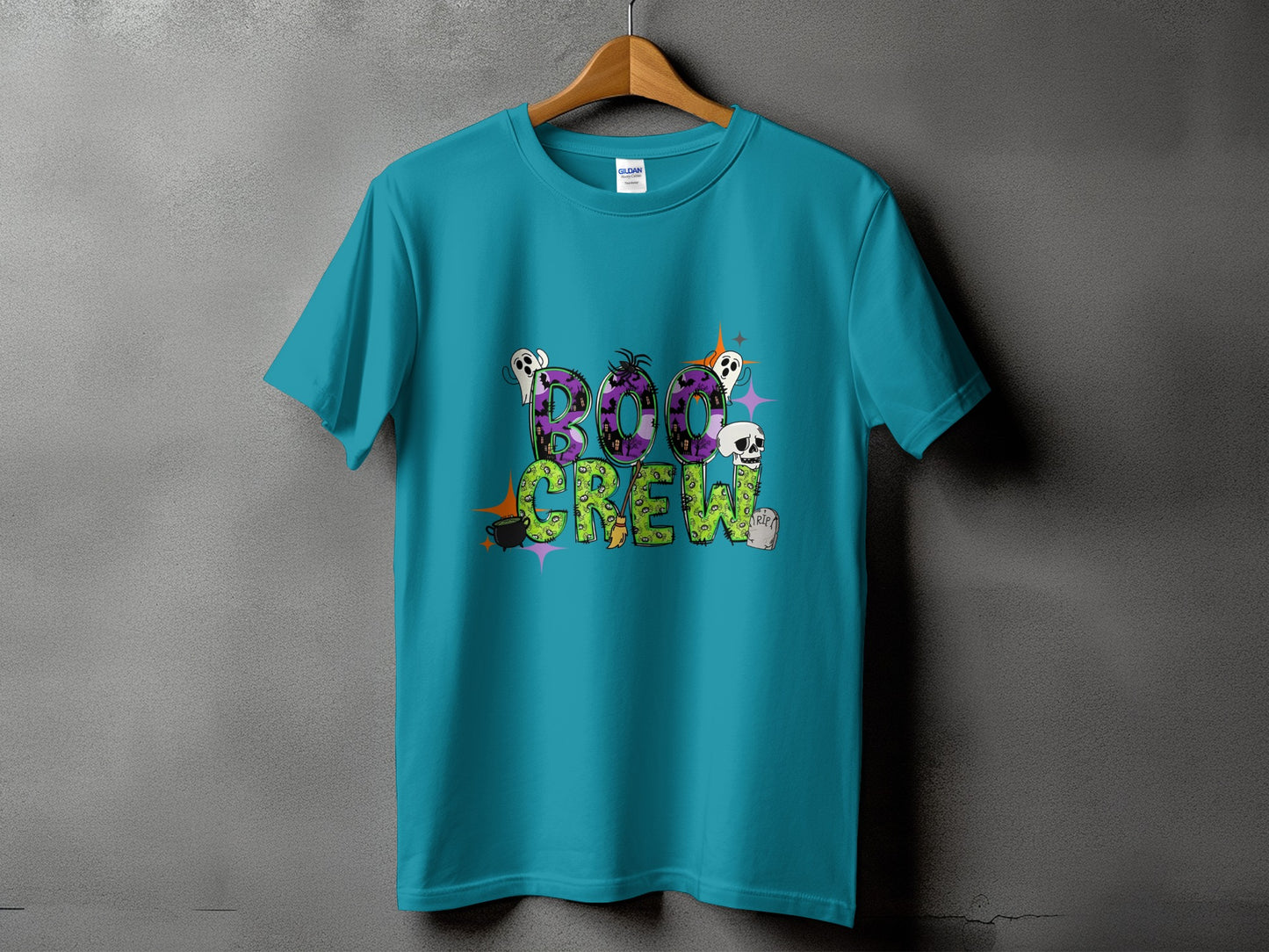Teal t-shirt with "Boo Crew" Halloween graphic featuring ghosts and skulls.