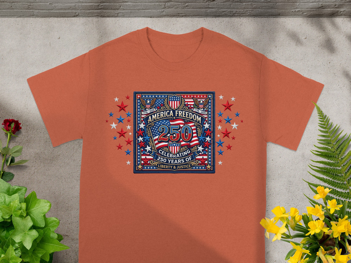Orange t-shirt with America Freedom 250th anniversary design.