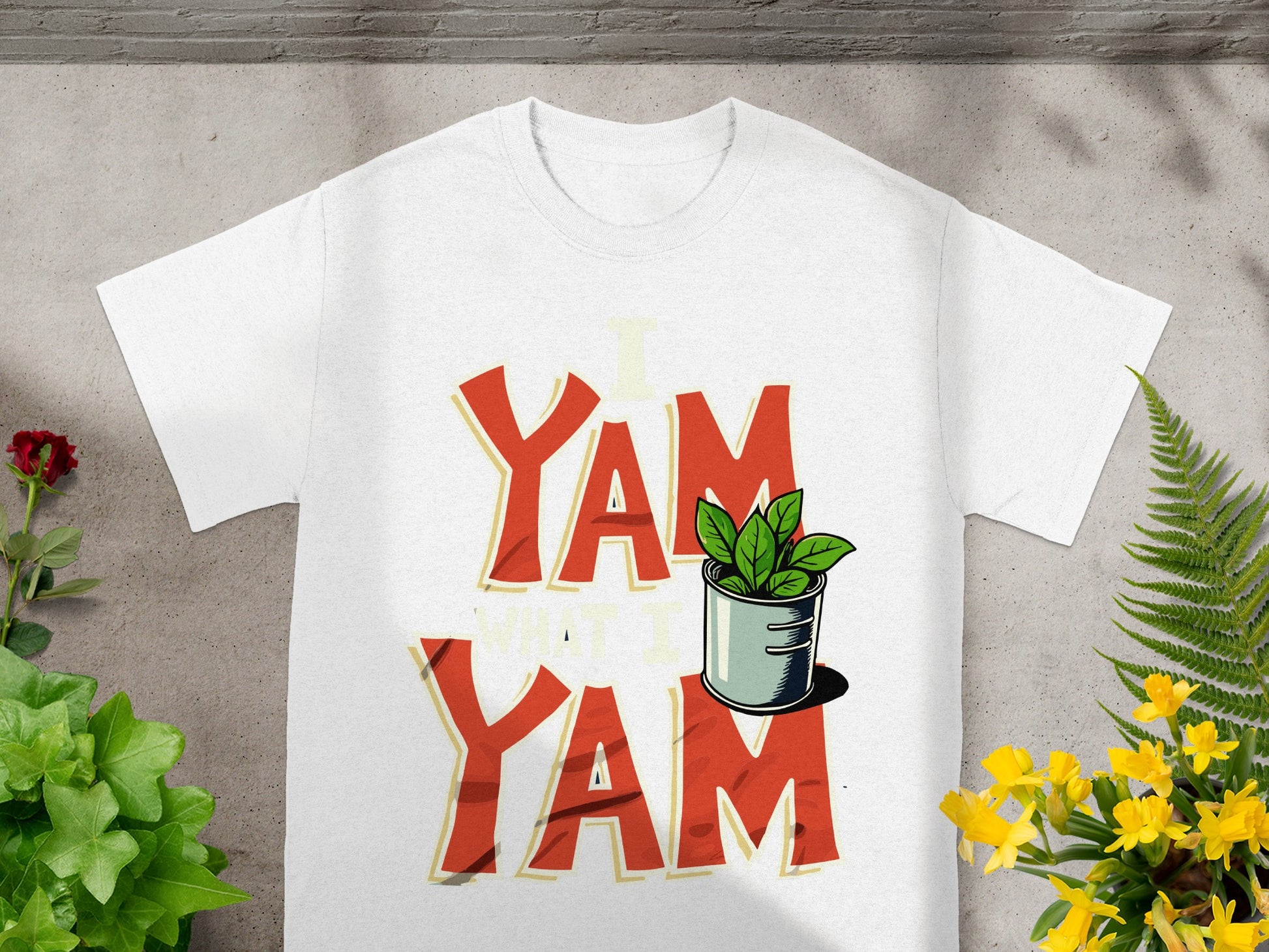 White t-shirt with "YAM YAM" text and a potted plant graphic.