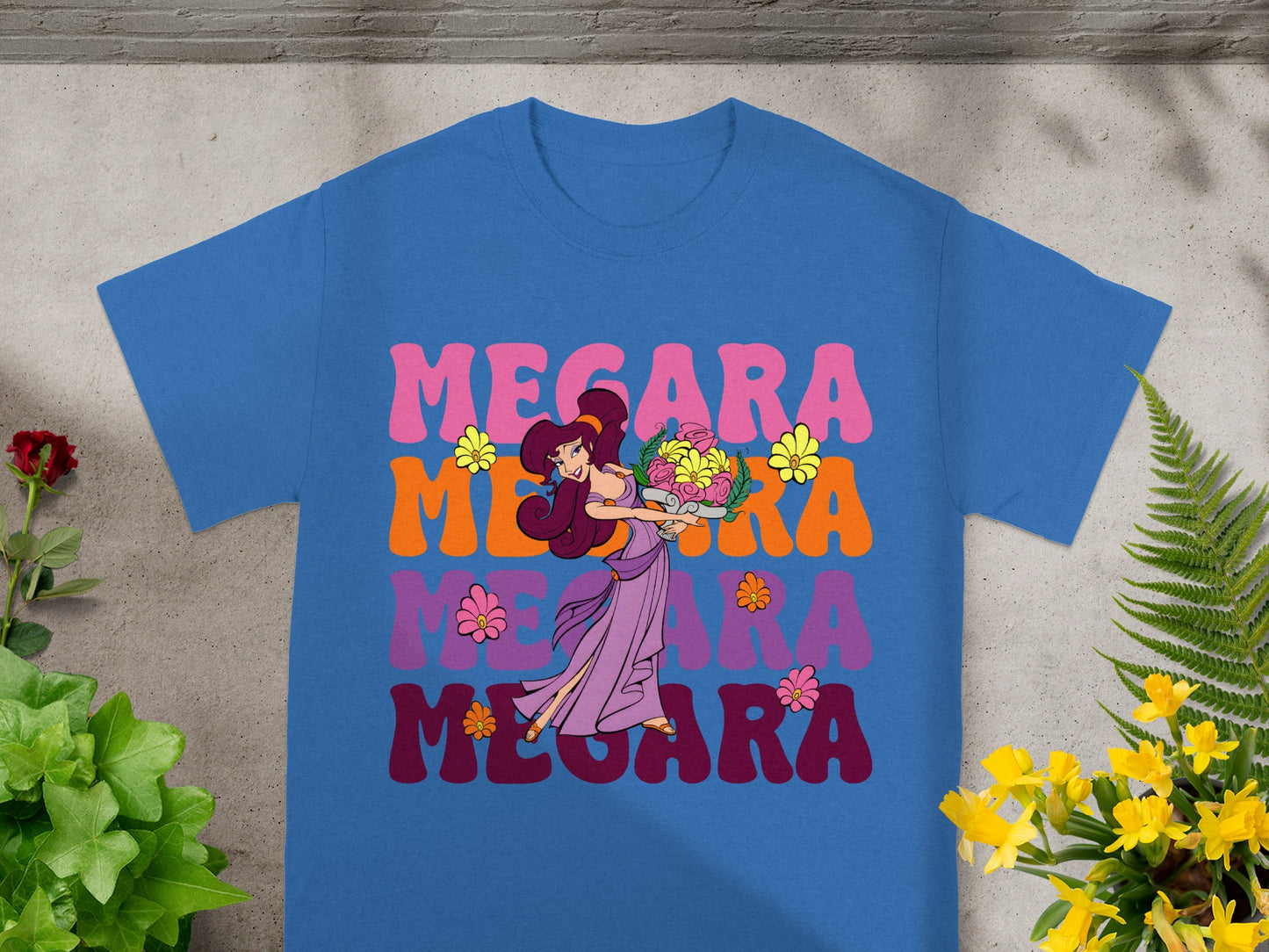 Megara graphic on a blue t-shirt with colorful text.