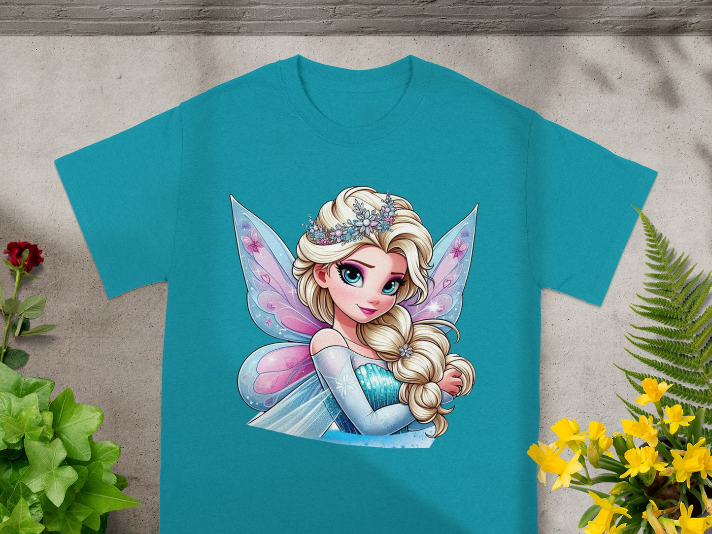 T-shirt with cartoon of a blonde princess with wings and a tiara.