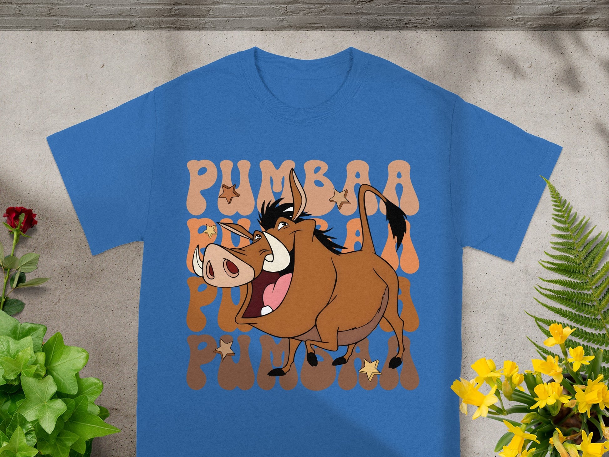 Blue t-shirt with Pumbaa character graphic and "Pumbaa" text.