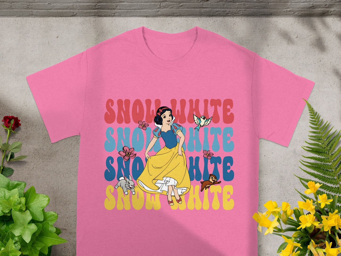 Pink t-shirt with "Snow White" text and character art.