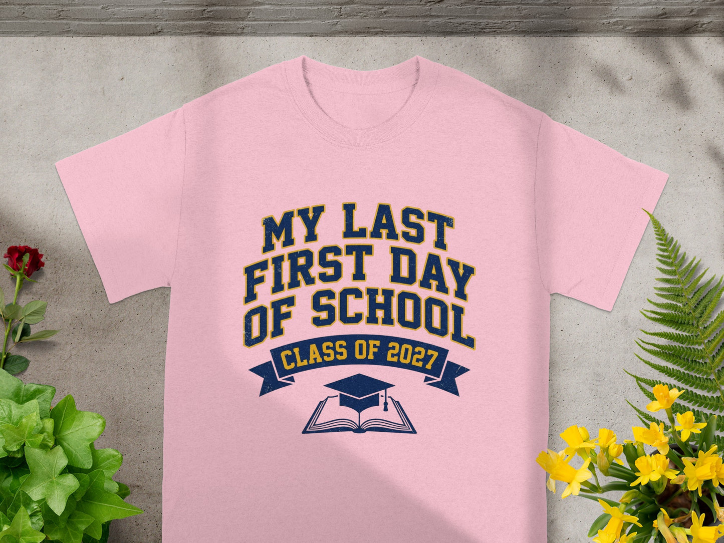 Pink t-shirt with "My Last First Day of School Class of 2027" text.