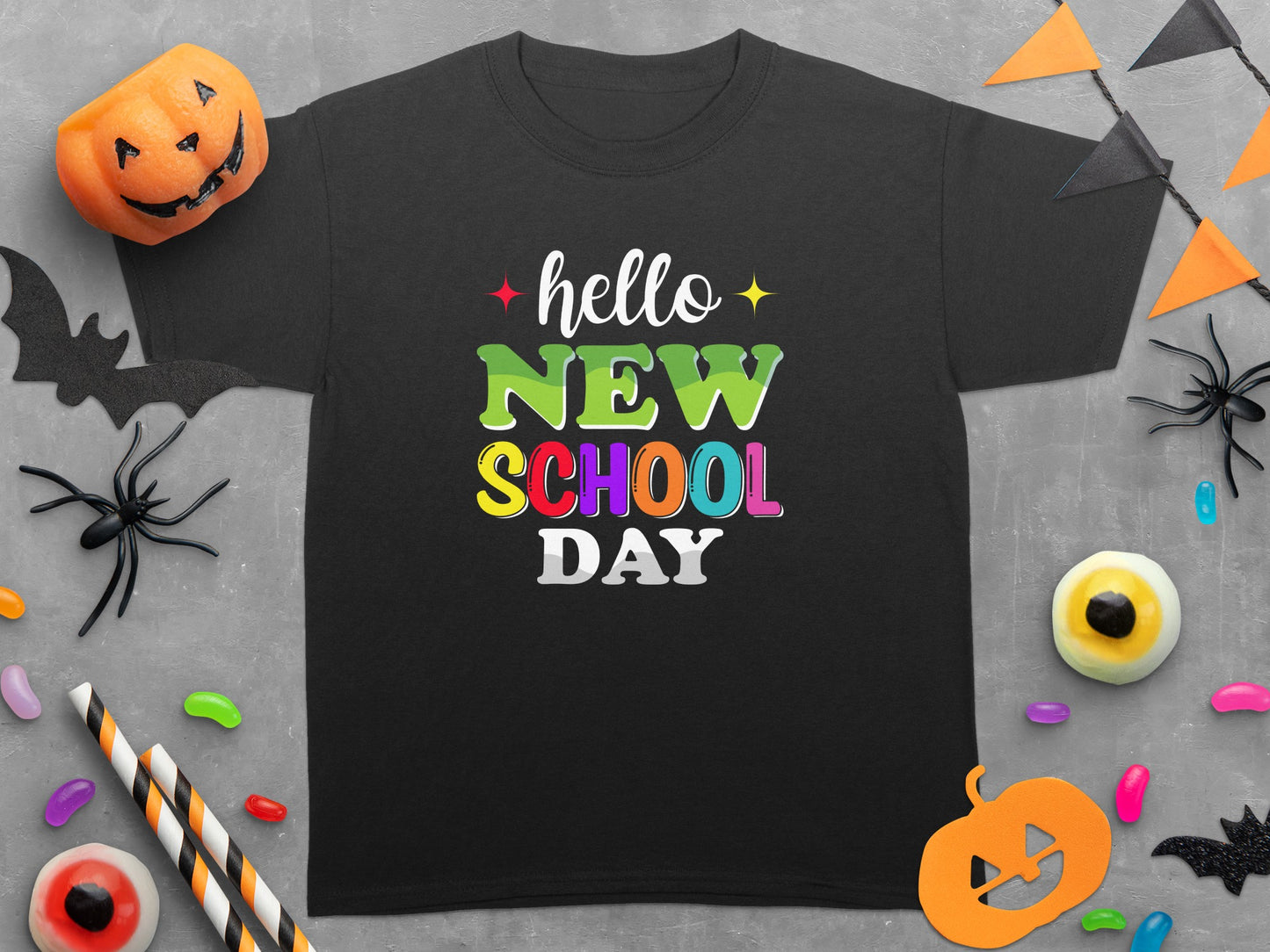 Black t-shirt with "hello NEW SCHOOL DAY" text and Halloween decorations.