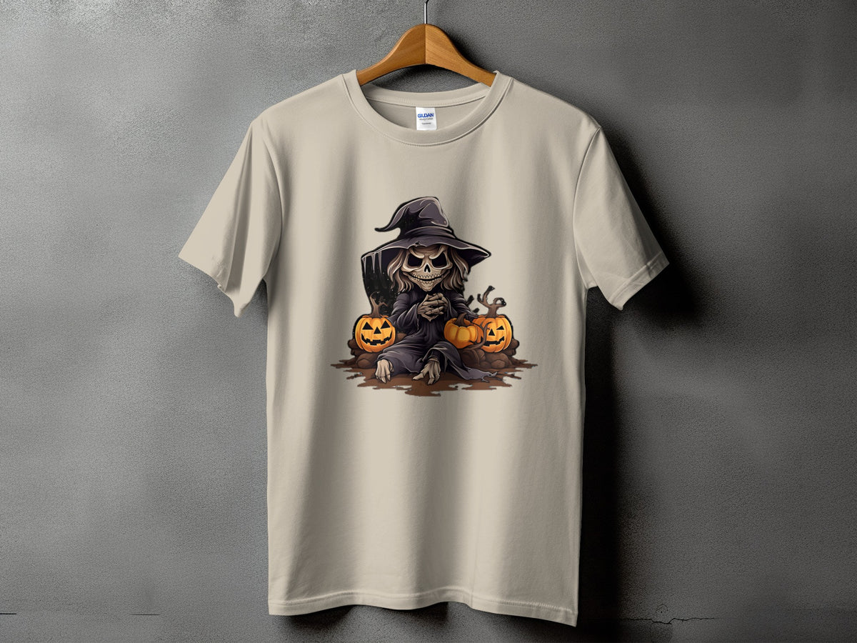 Light beige t-shirt with a Halloween-themed graphic of a skeletal figure in a witch hat and pumpkins.