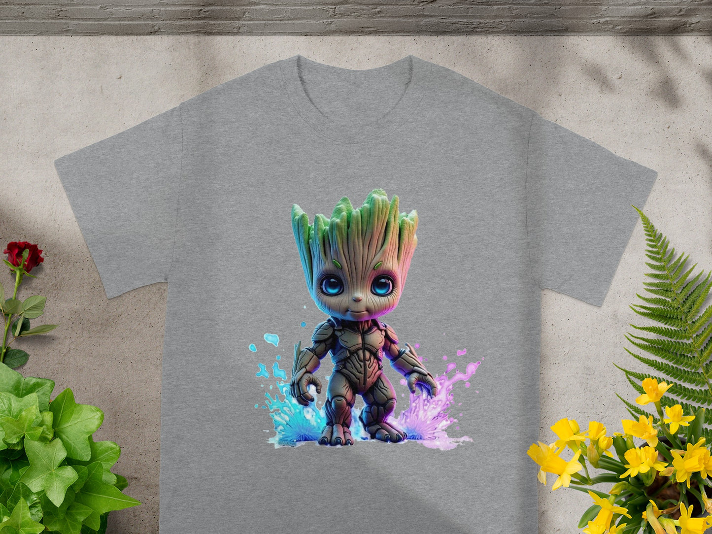 Grey t-shirt with Groot illustration and pink and blue paint splatters.