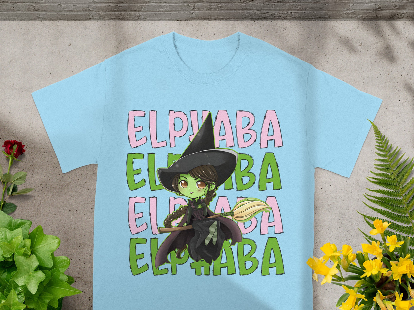 Light blue t-shirt with green witch and "Elphaba" text.