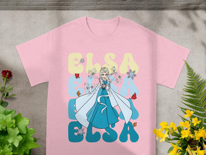 Pink t-shirt with Elsa from Frozen illustration and "ELSA" text.