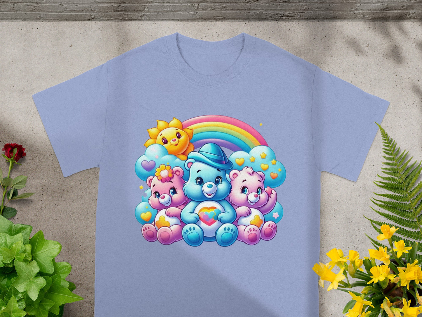 Three Care Bears characters sitting with a rainbow and sun.