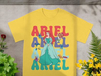 Yellow t-shirt with Ariel and colorful "Ariel" text.