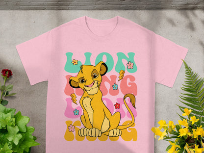 Pink t-shirt featuring Simba from The Lion King with "LION KING" text.