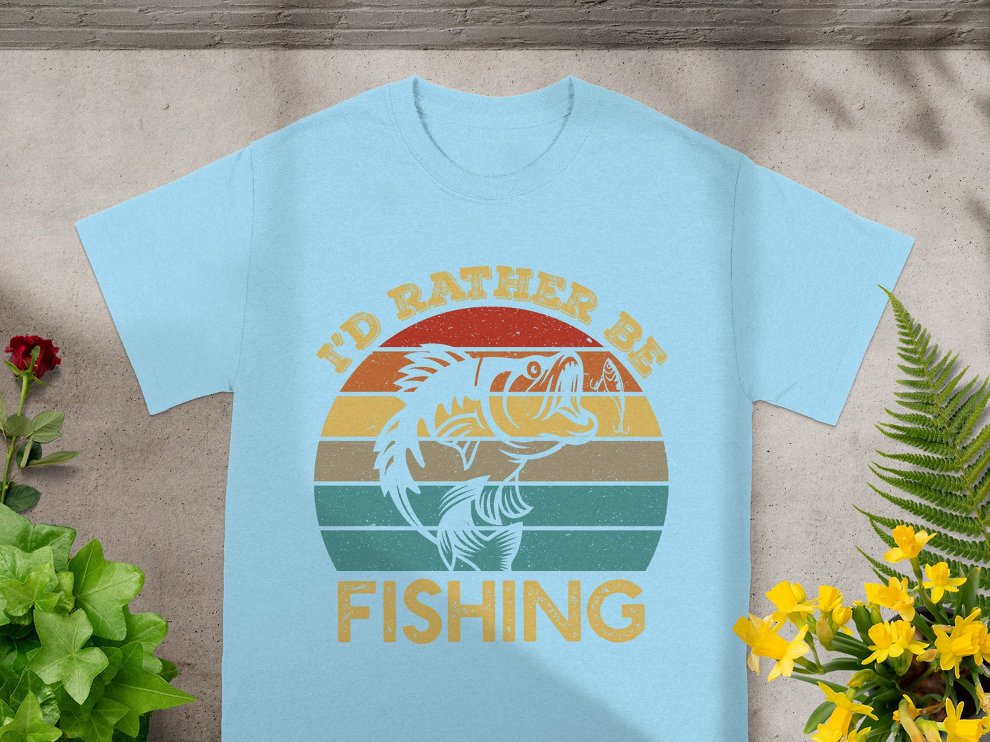 Light blue t-shirt with "I'd Rather Be Fishing" text and a stylized fish graphic.