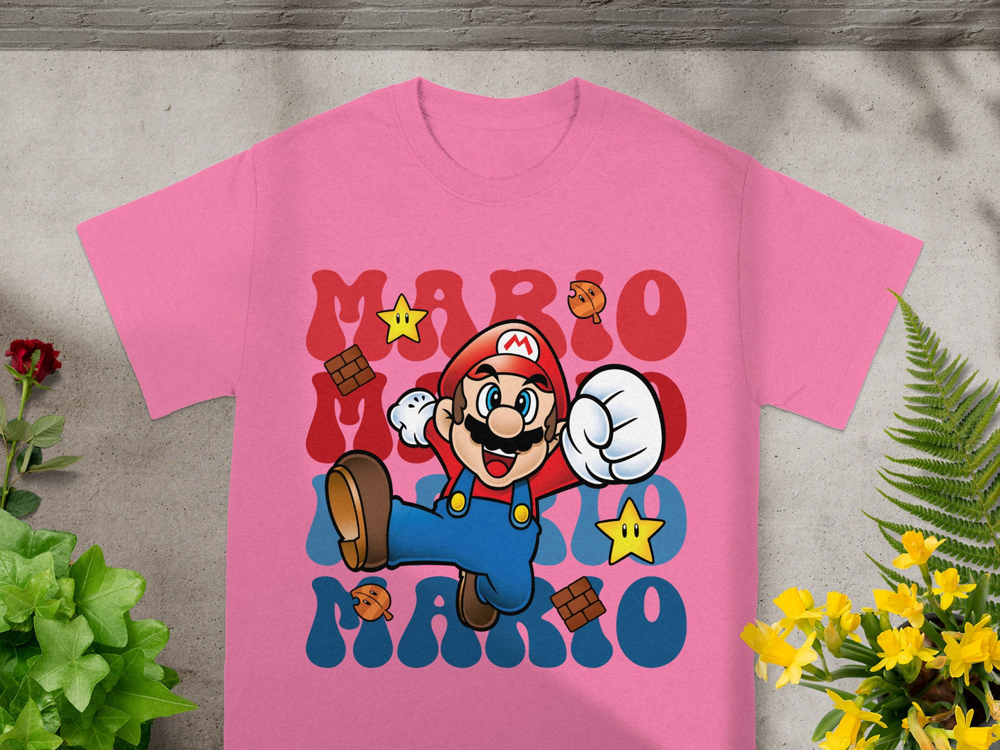 Pink t-shirt with Mario graphic and "MARIO" text.