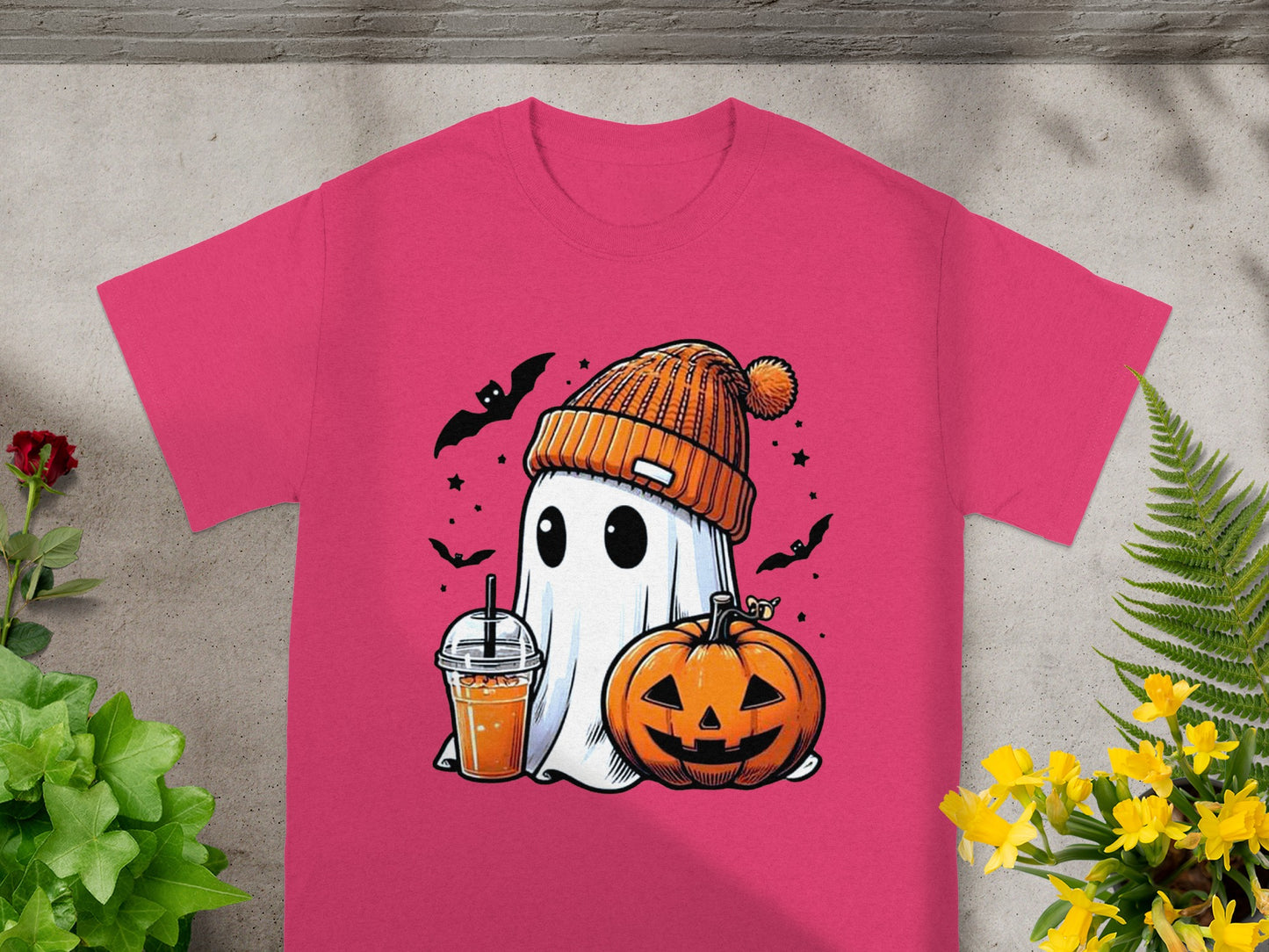 Ghost in beanie with pumpkin and drink on pink t-shirt.