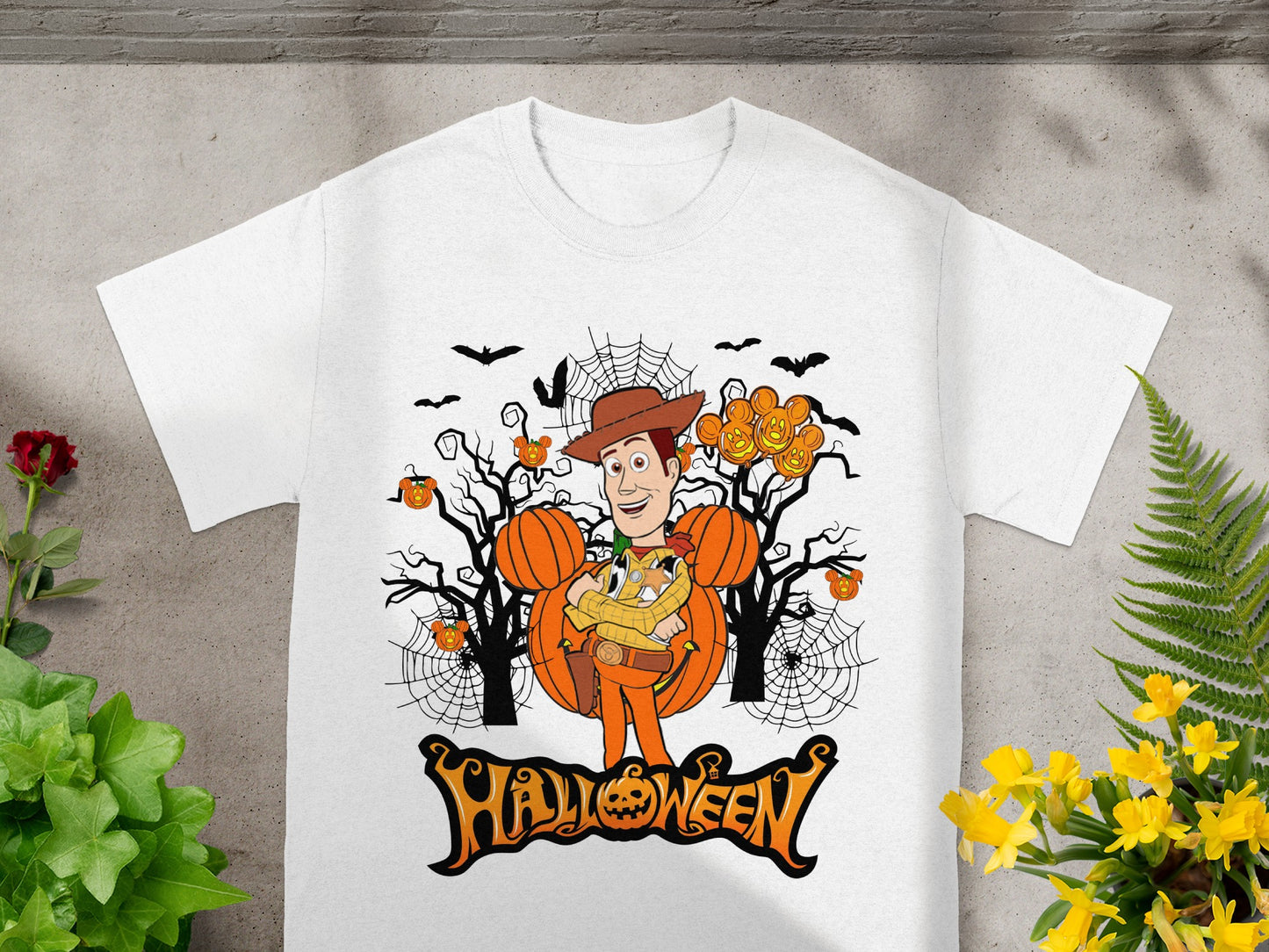 Woody character surrounded by pumpkins, spiderwebs, bats, and the word Halloween.