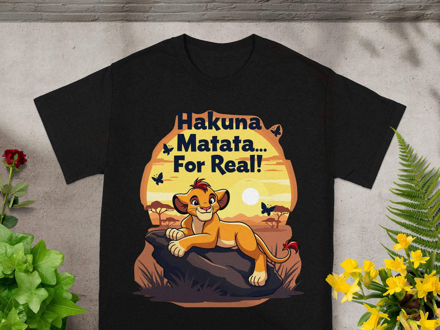 Black t-shirt with Simba from The Lion King saying "Hakuna Matata... For Real!".