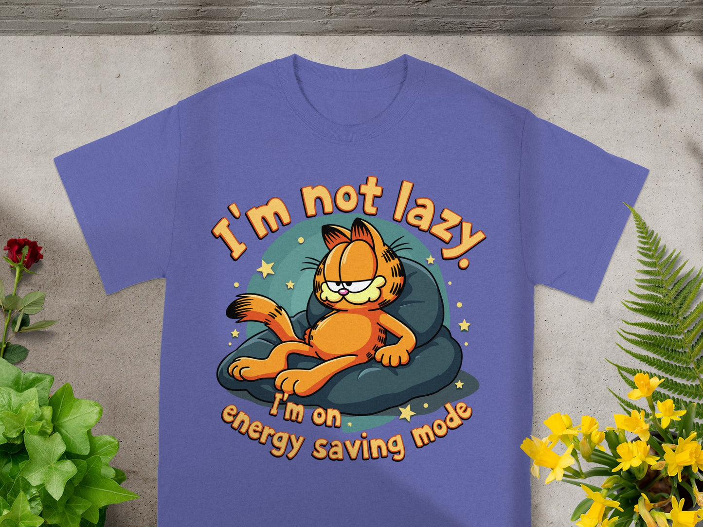 Purple t-shirt with Garfield relaxing on a pillow, text reads "I'm not lazy. I'm on energy saving mode."