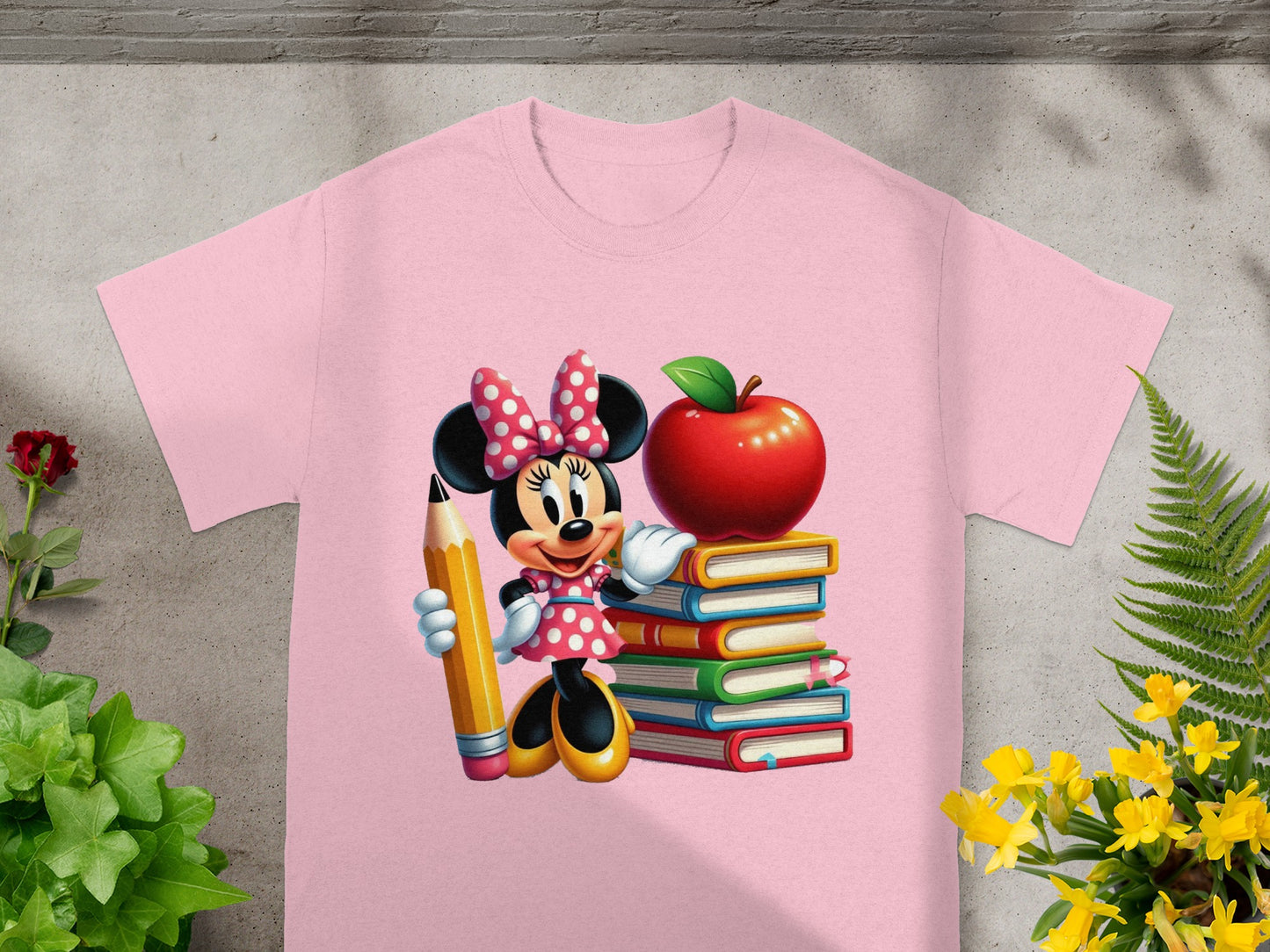 Minnie Mouse holding a pencil next to a stack of books and an apple.