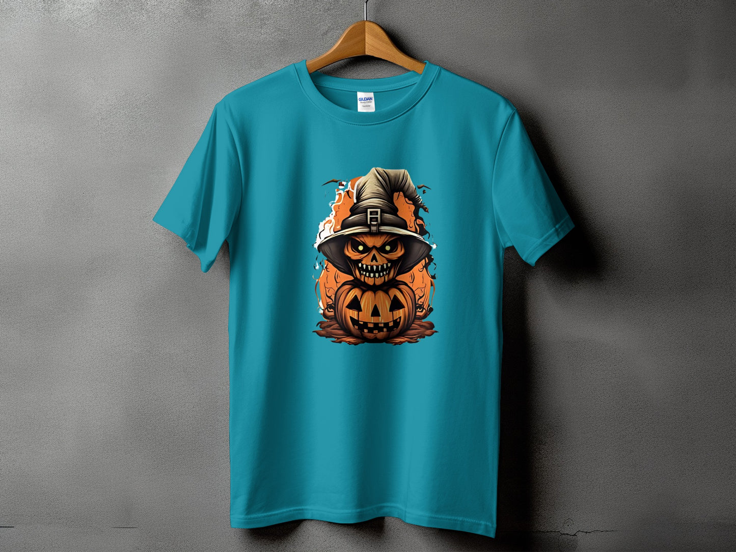 Teal t-shirt with a jack-o-lantern wearing a witch hat with flames.